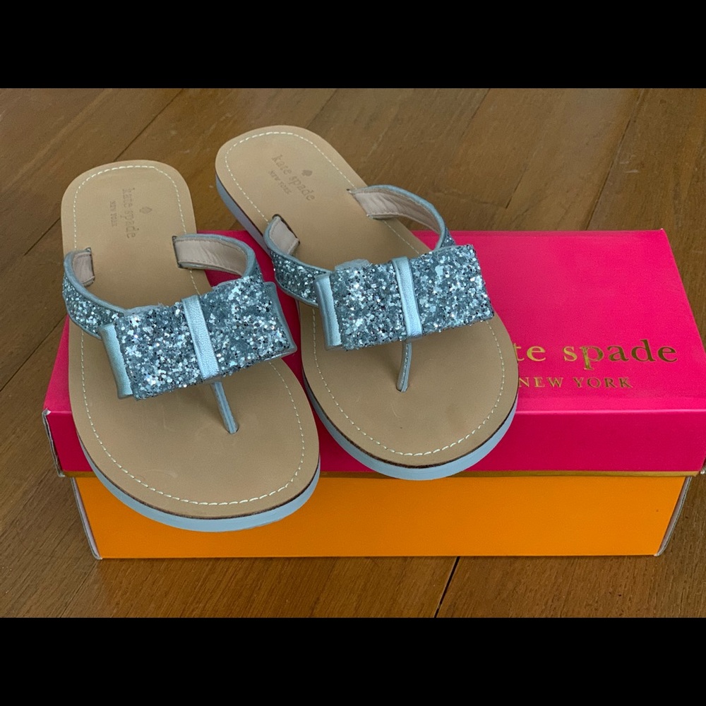 NIB. Kate Spade. 7.5. Silver bow flip flops.
